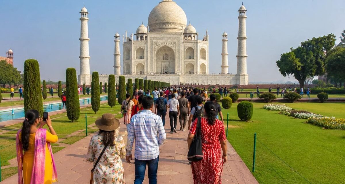 Visitors walking through the gardens at the Taj Mahal
