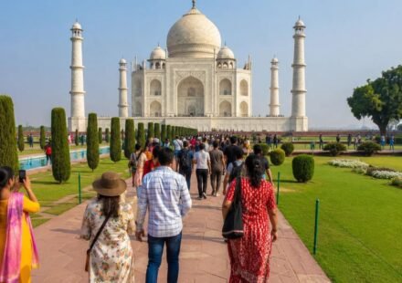 Visitors walking through the gardens at the Taj Mahal