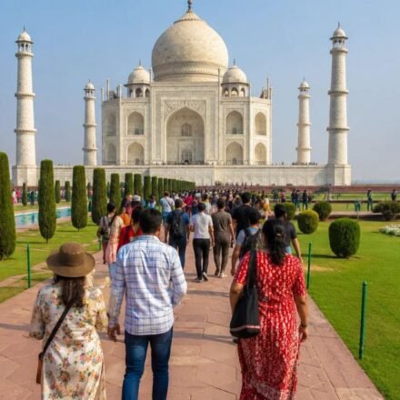 Visitors walking through the gardens at the Taj Mahal